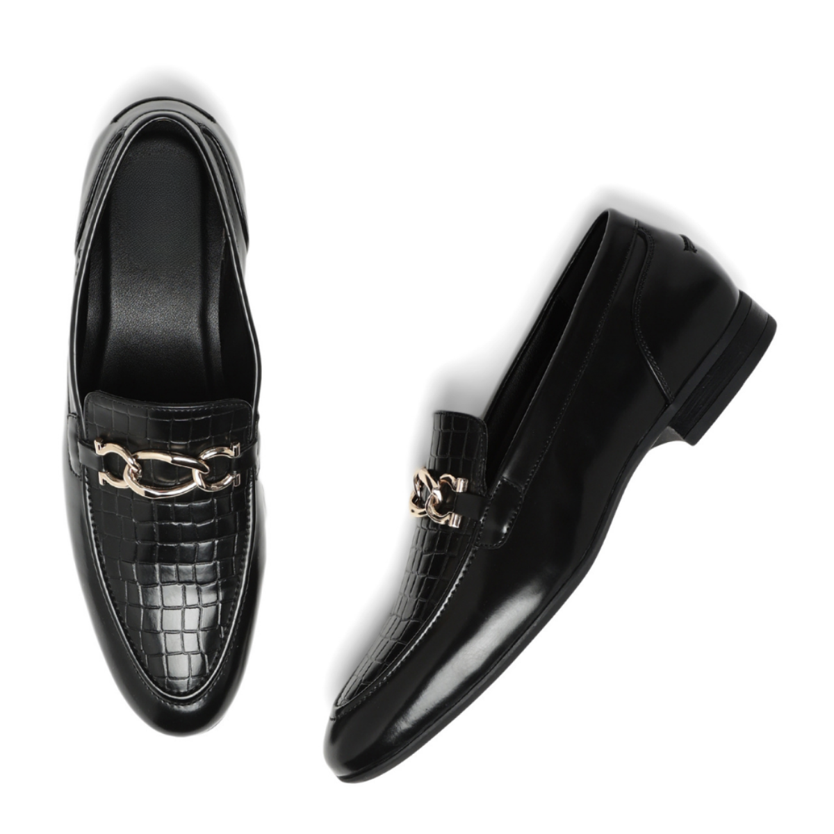A pair of black leather loafers, one shown from a top-down view and the other from a side angle, featuring a glossy crocodile-embossed texture and a gold-tone chain detail across the vamp.