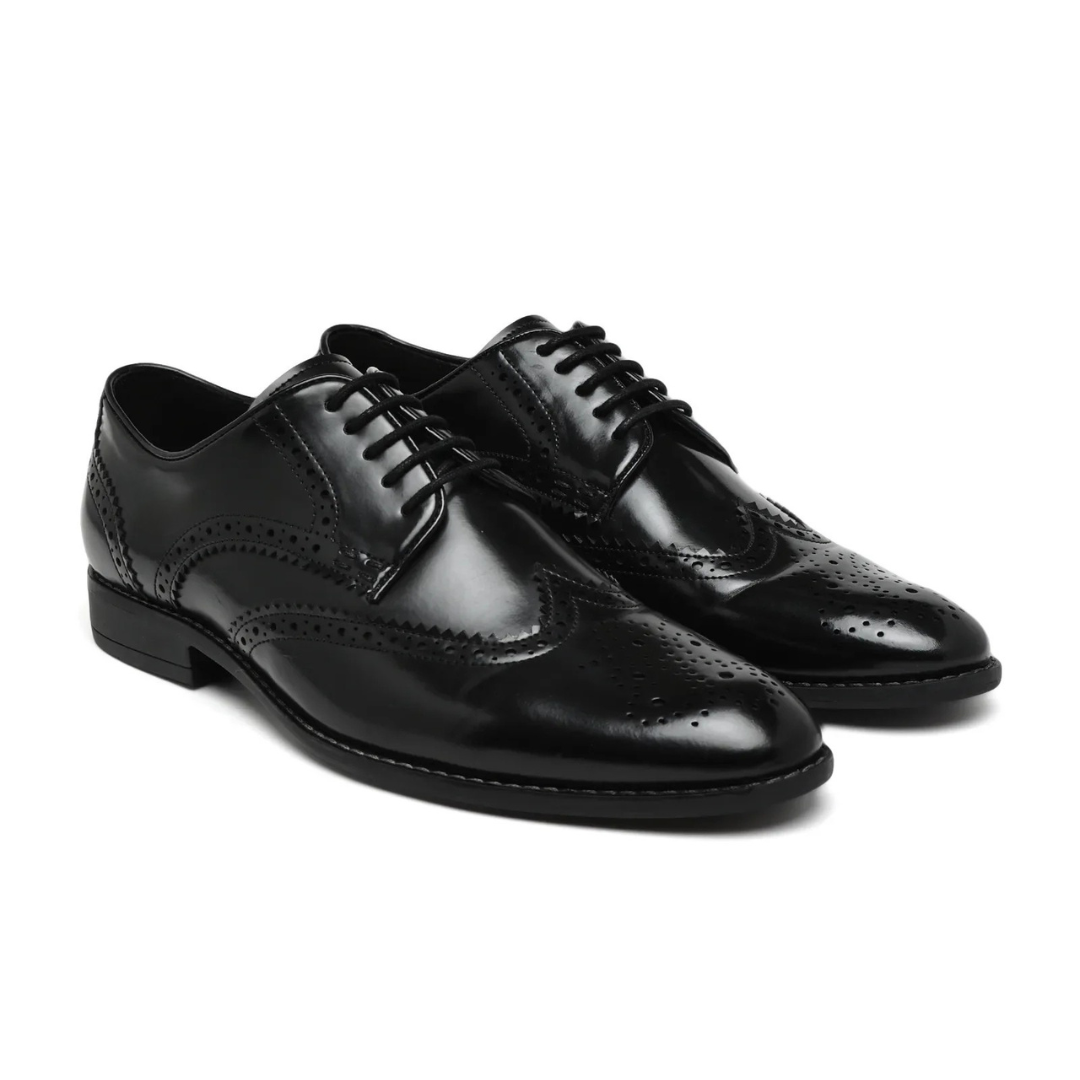 Pair of black dress shoes on a white background