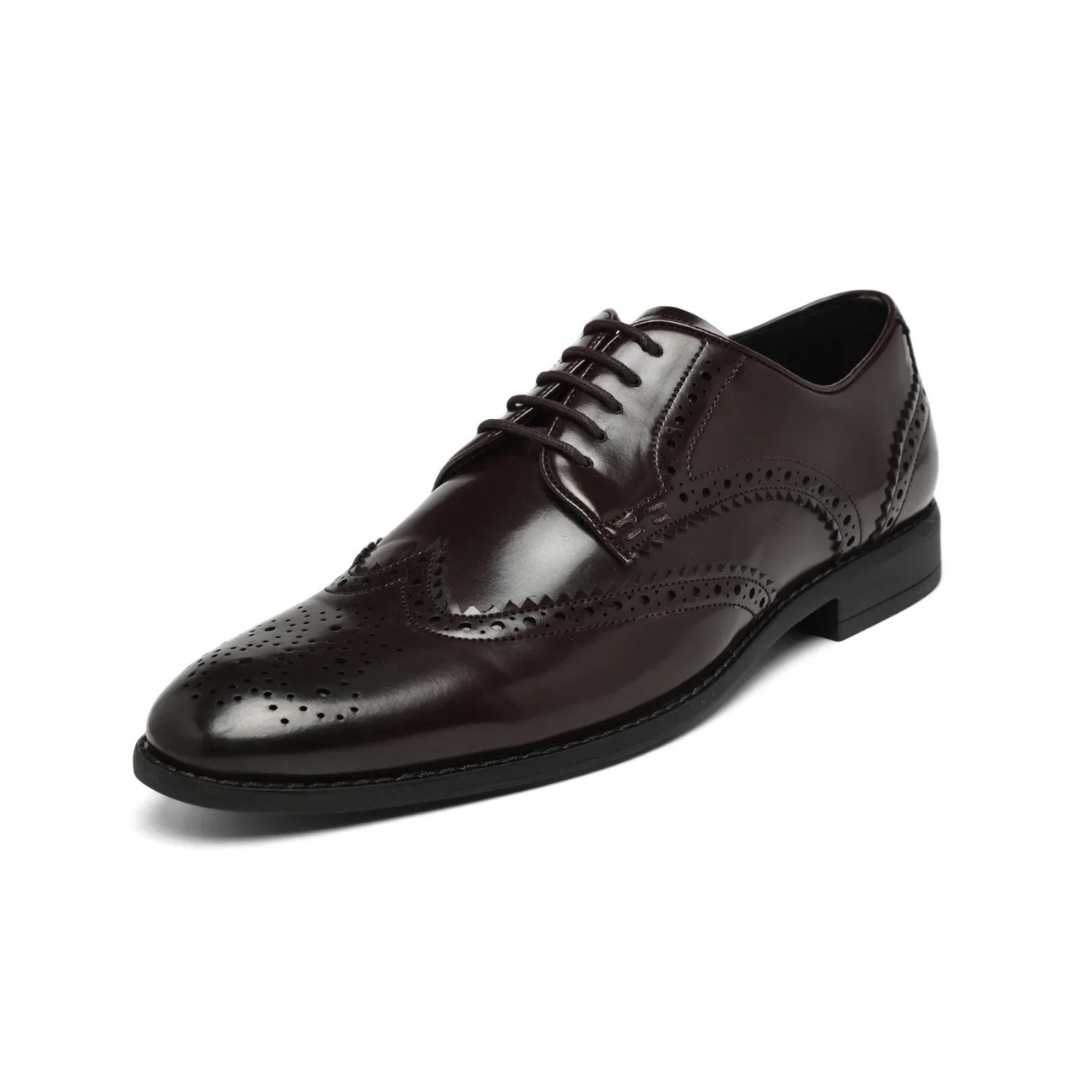 A dark brown leather wingtip oxford shoe with decorative brogue perforations