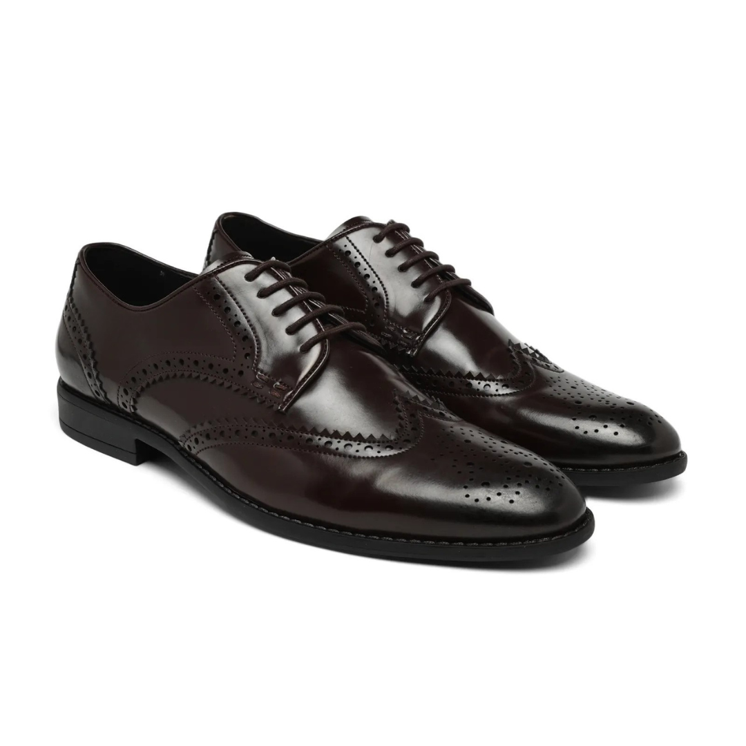 A dark brown leather wingtip oxford shoe with decorative brogue perforations