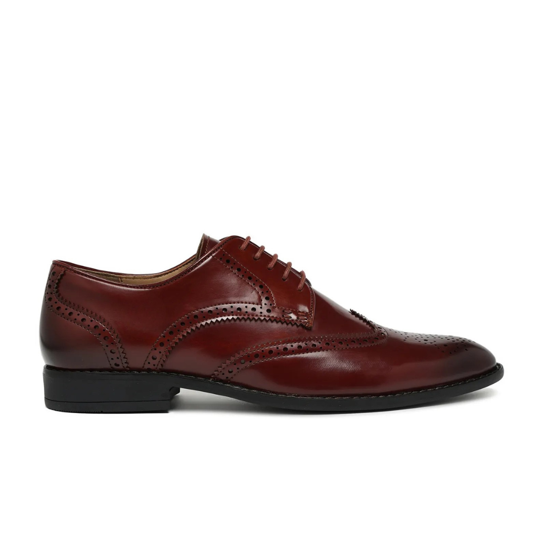 Pair of brown leather dress shoes on a white background