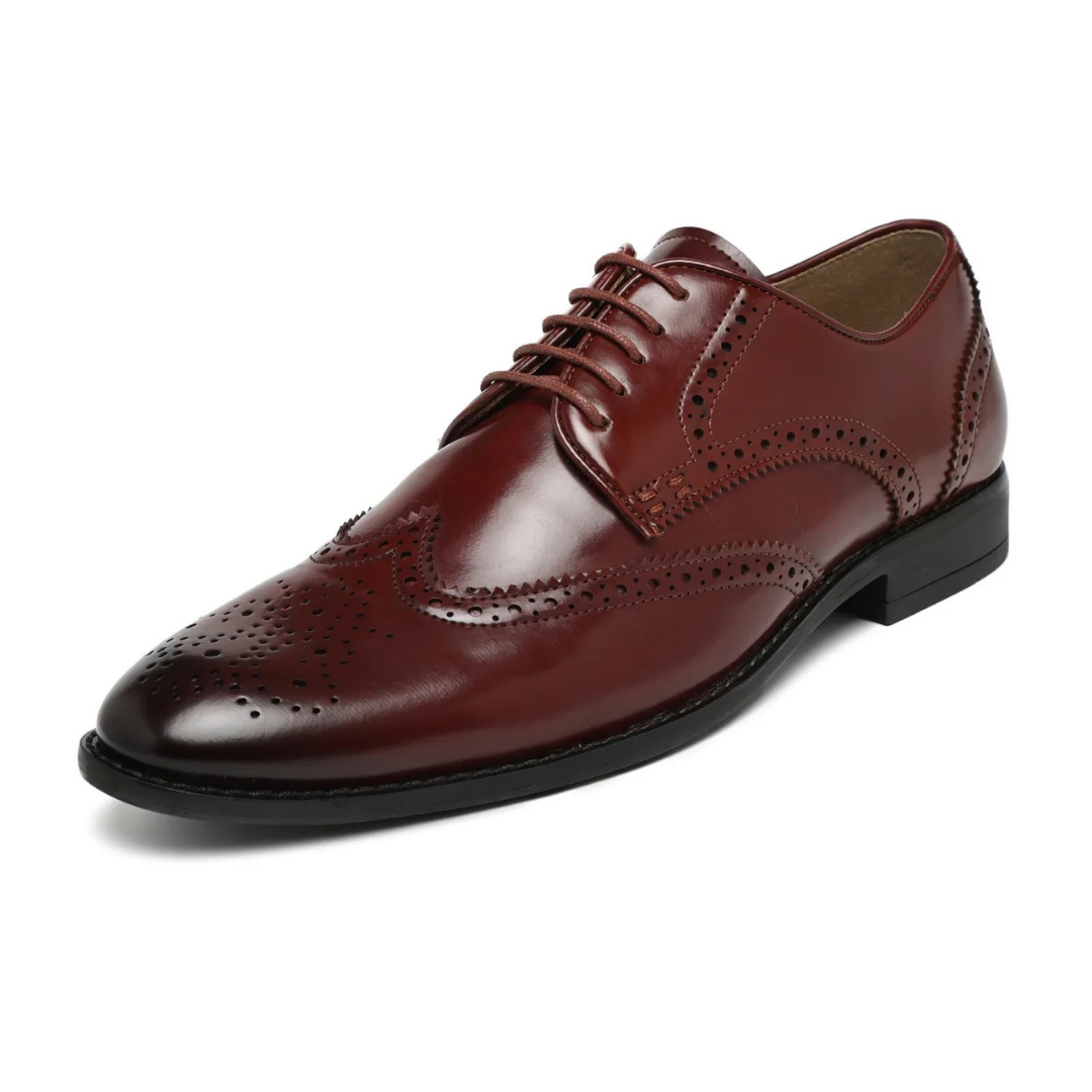 Pair of brown leather dress shoes on a white background