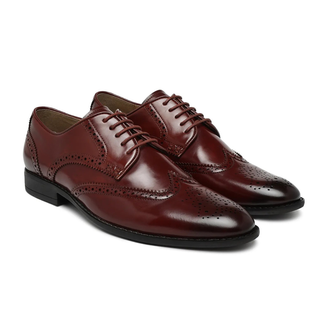 Pair of brown leather dress shoes on a white background