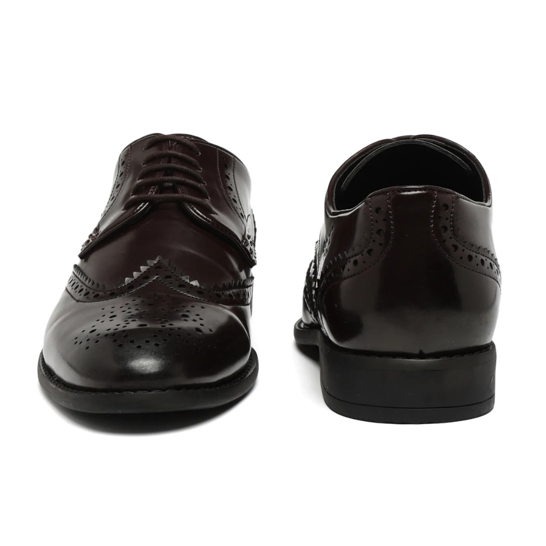 A dark brown leather wingtip oxford shoe with decorative brogue perforations