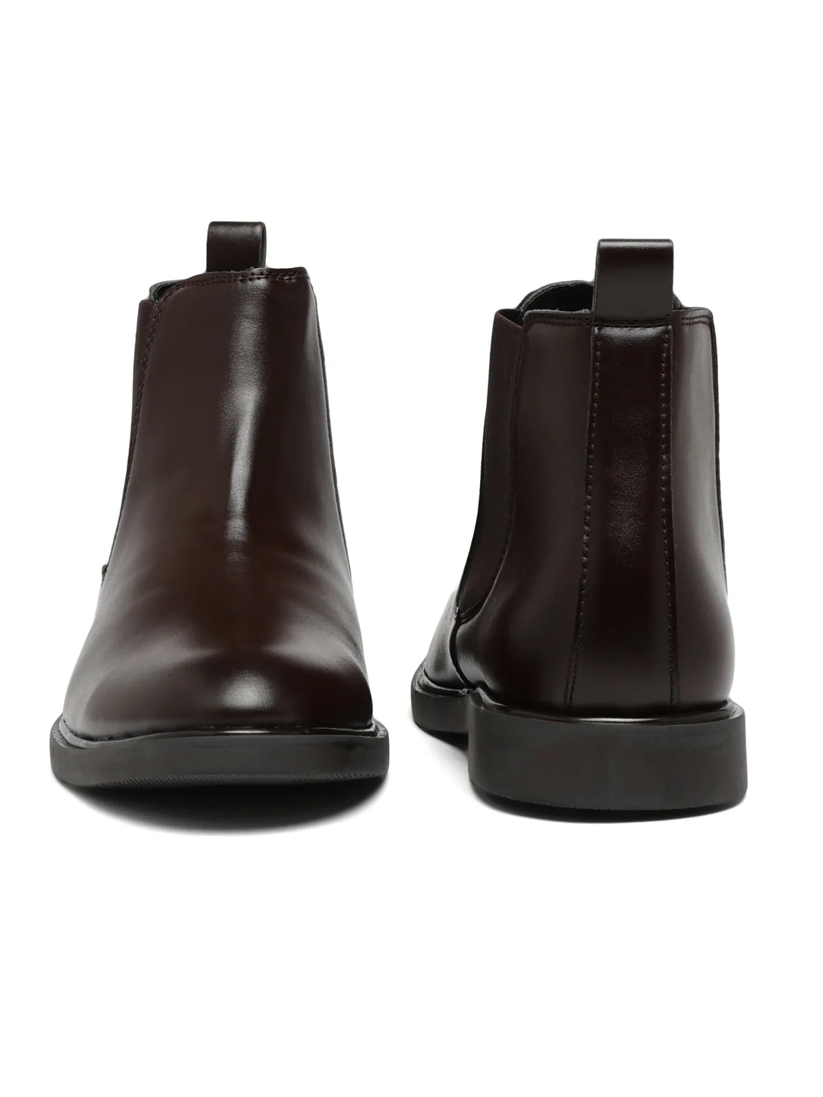 Pair of dark brown leather boots on a white background