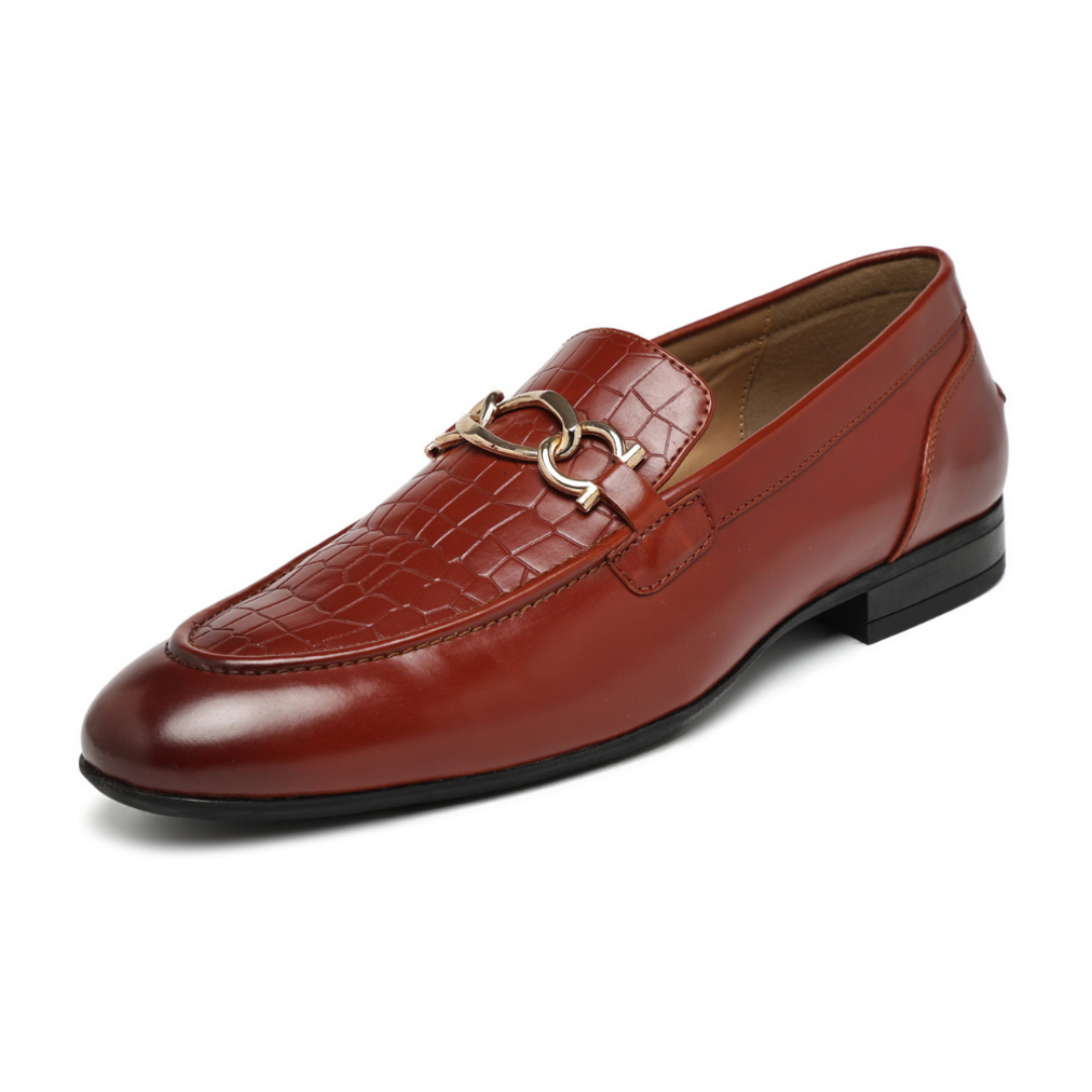 A single men's loafer in reddish-brown leather with a crocodile-embossed pattern on the toe, a smooth leather vamp, and a gold-tone horsebit detail across the instep. The shoe is photographed from a three-quarters angle on a clean white background.