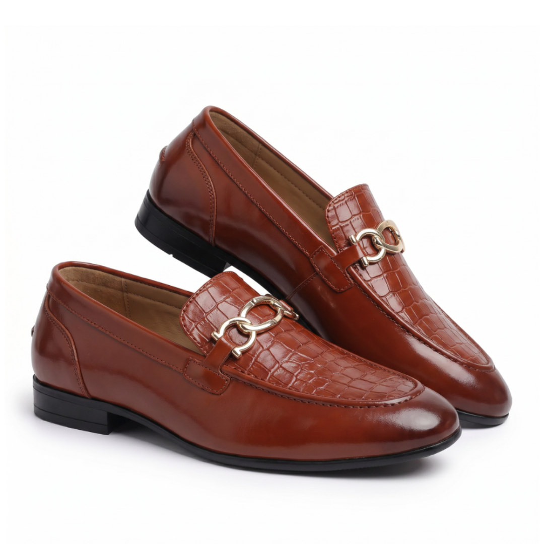 Pair of brown leather loafers with a gold buckle on a white background
